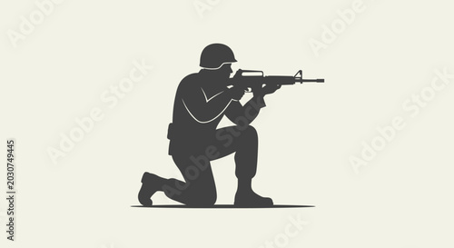 Soldier in kneeling position aiming rifle.