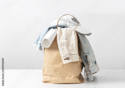 Canvastavla Pile of casual denim clothes prepared for donation, recycling or secondhand resale in sustainable fashion culture