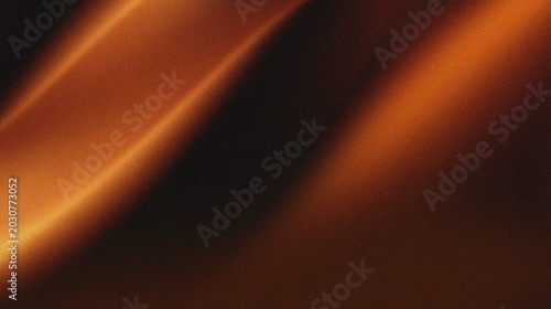 Foto Orange, brown, and black colors that resemble folds of fabric or sand dunes in low light