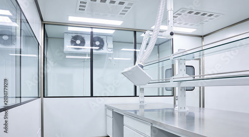 Fotografie Modern laboratory cleanroom with stainless steel workbench and ventilation syste