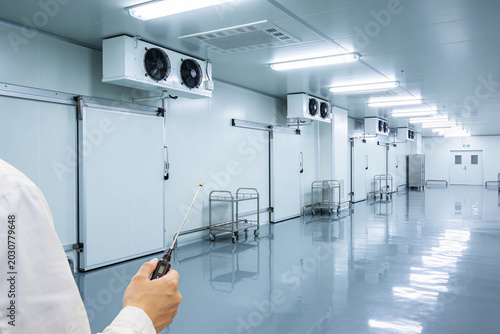 Photos Professional inspecting a sterile cold storage facility with climate control sys