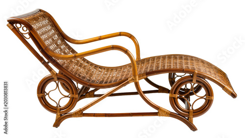 Fotografie Wicker rattan chaise lounge chair with curved arms and decorative wheels