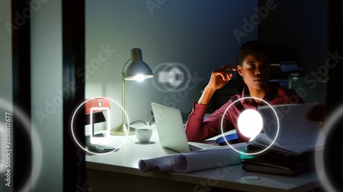 Woman working late at desk in tech office, reacting to floating alert icons, rubbing temples