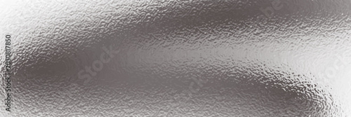 Foto Silver foil background with grainy texture