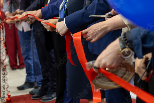 Obraz na płótnie Business Leaders Cutting Red Opening Ribbon