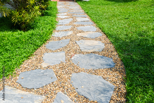 Billede på lærred Garden landscape design with pathway in garden and footpath in picturesque summer park and staircase in backyard,Paving stones on floor in park,space for text