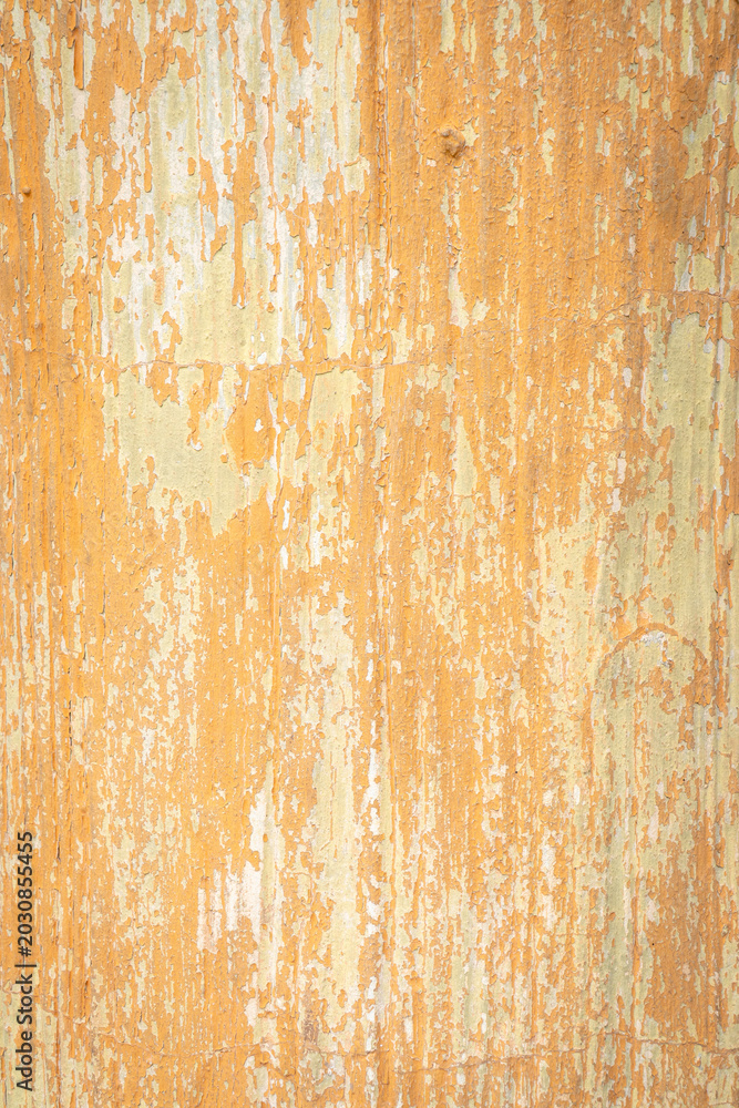 Fototapeta premium Weathered orange paint texture with peeling wooden surface and rustic abstract pattern for vintage background design.