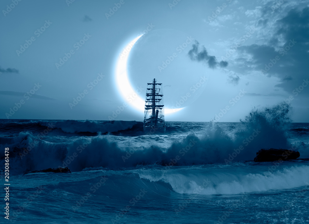 Fototapeta premium Sailing old ship in storm sea - Night sky with crescent moon in the clouds 