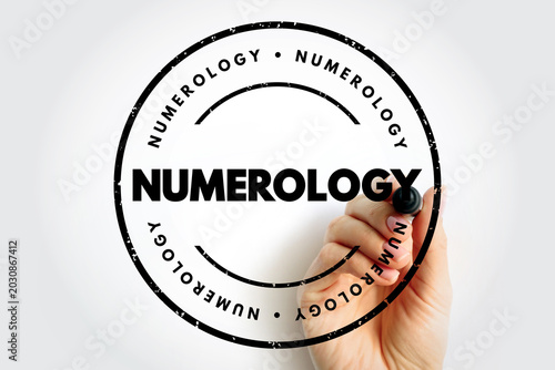 Quadro em tela Numerology text on circular rubber stamp concept with hand holding marker