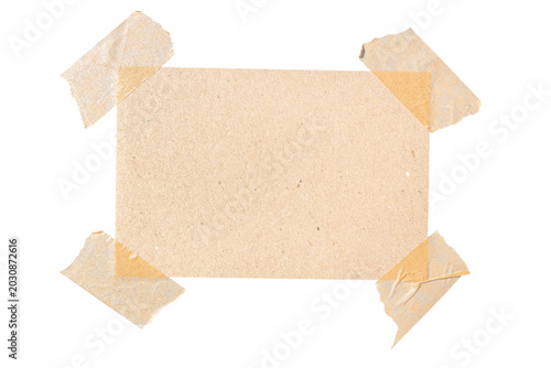 Photography rectangular piece of blank brown paper affixed with four masking tape cut out