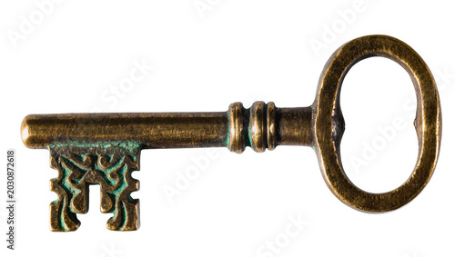 Foto Antique brass skeleton key with ornate bit and verdigris patina