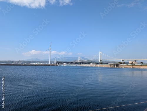 Calm sea and waterfront view with Hakucho Bridge in Hokkaido Japan