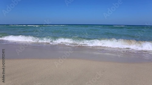Travel summer background with blue sky and turquoise water .