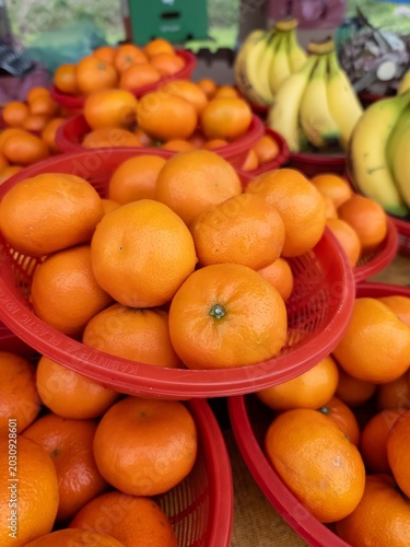 Oranges in basket for sale at the market.