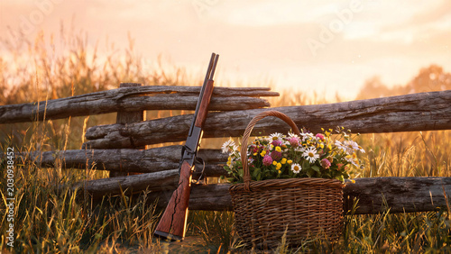 A peaceful still life featuring an old vintage rifle leaning against a rustic wooden fence next to a wicker basket full of wildflowers at sunset. Symbolizing the transition to peace for the Internatio