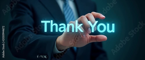 Hand interacting with holographic thank you message interface showing glowing Thank You symbols in empty space concept as Hand interacts with holographic thank you message interface displaying glowing