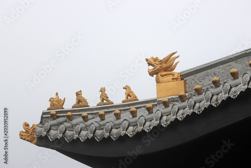 Принти на полотні Chinese temple flying eave with geometric patterns and ridge beasts in gold colo