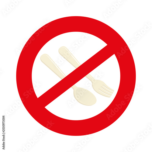 Foto A red prohibition sign with a diagonal line over disposable plastic cutlery, symbolizing a ban on single-use plastic utensils and promoting environmental awareness