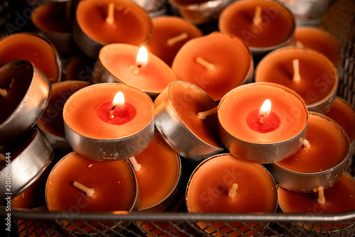 Fotografía Glowing Tealight Candles in Metal Holders, Cozy Warm Light Background for Autumn