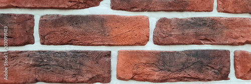 Canvastavla A close-up view of a textured red brick wall