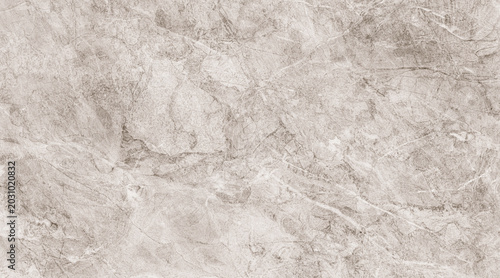 A close-up, abstract view of a light beige marble texture with subtle grey veining, showcasing natural patterns and geological formations