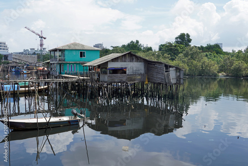 stilt house over calm water in batam
