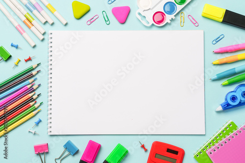 School supplies or office stationery on blue background.