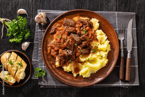 Obraz na płótnie slow cooked beef meat stew served with mashed potatoes