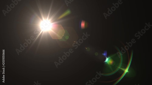 optical light ray loop animation on black screen. Sun rays view, sun spotlight glowing burst concept. optical light beams on black background. 