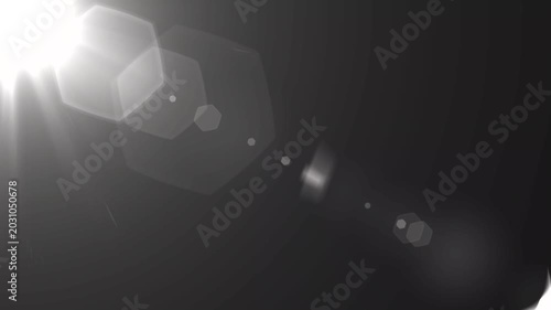 optical light ray loop animation on black screen. Sun rays view, sun spotlight glowing burst concept. optical light beams on black background. 