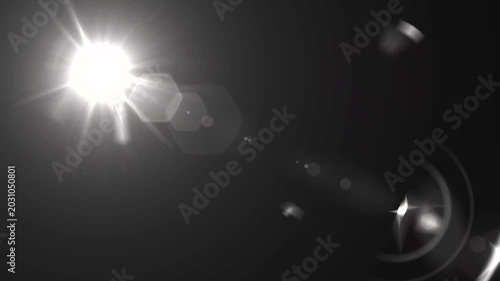 optical light ray loop animation on black screen. Sun rays view, sun spotlight glowing burst concept. optical light beams on black background. 