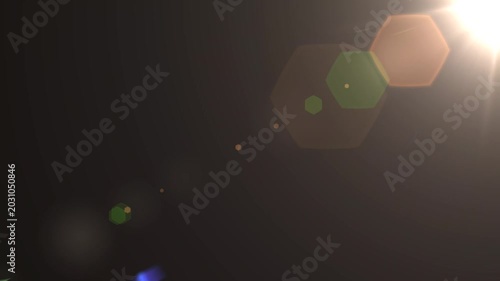 optical light ray loop animation on black screen. Sun rays view, sun spotlight glowing burst concept. optical light beams on black background. 