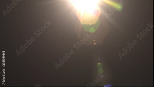 optical light ray loop animation on black screen. Sun rays view, sun spotlight glowing burst concept. optical light beams on black background. 