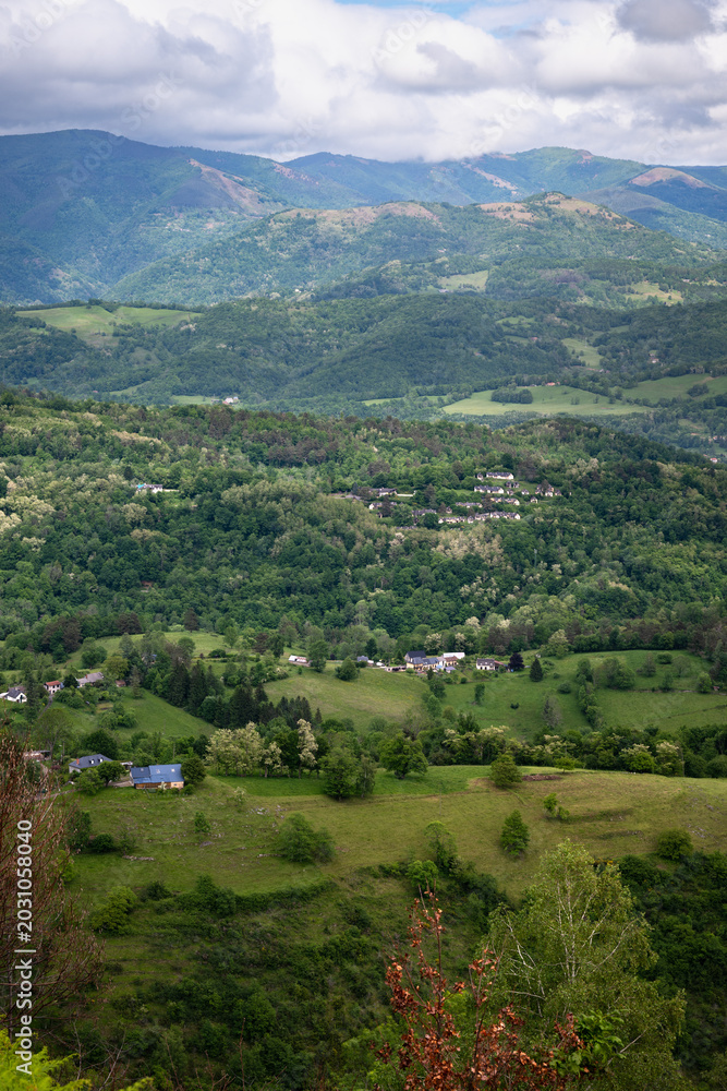 Obraz premium Landscape with green mountains and cloudy sky. Ariege Pyrenees France
