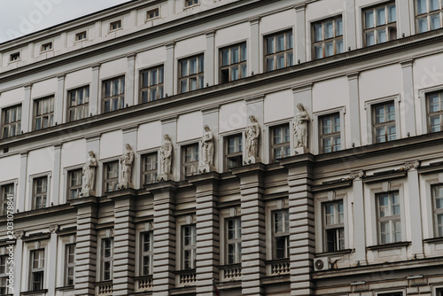 Historic building facade with classical sculptures and windows in Belgrade Serbia. Concept of heritage architecture, culture and European history