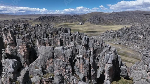 Cinematic Low-altitude drone flyover through the rock formations of Huayllay Stone Forest in Pasco, Peru