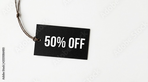 Black discount tag with 50 percent off text on white background, concept of retail sale and promotion