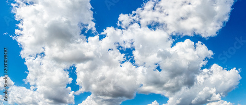 Photography Bright blue sky with fluffy white cumulus clouds on sunny day, fresh summer atmo