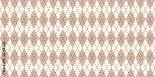 ​Seamless argyle pattern with textured beige diamonds and pink intersecting lines on a cream background. Vintage geometric fabric design.