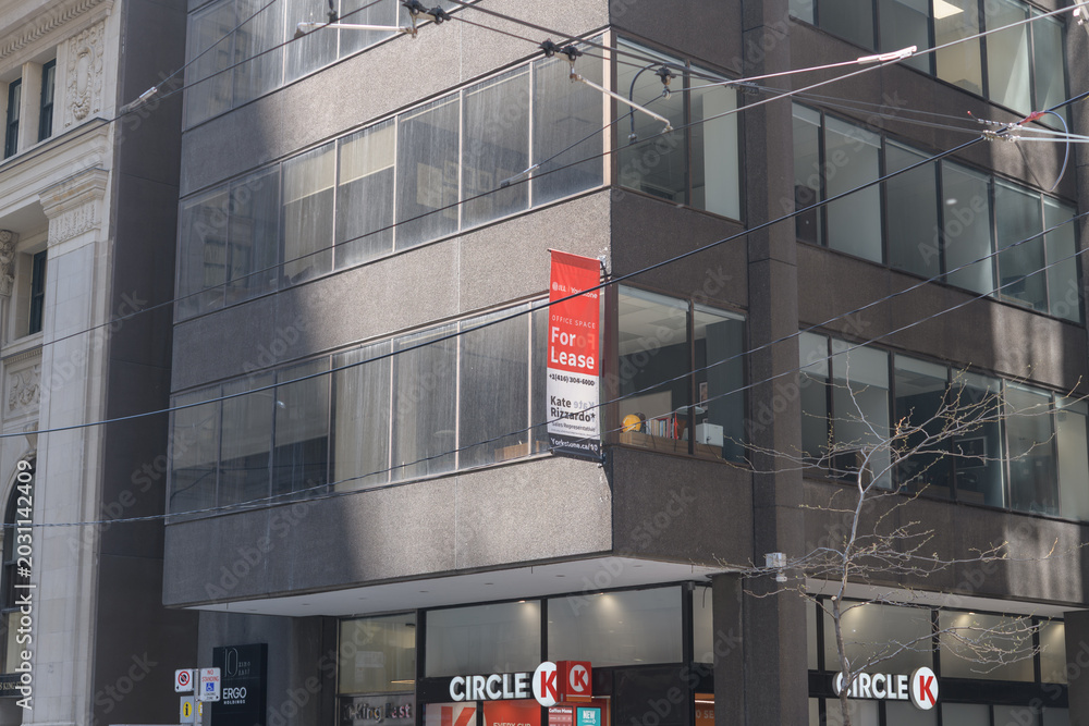 Naklejka premium For Lease sign outside 10 King St E, location of Circle K, a convenience store chain, Toronto