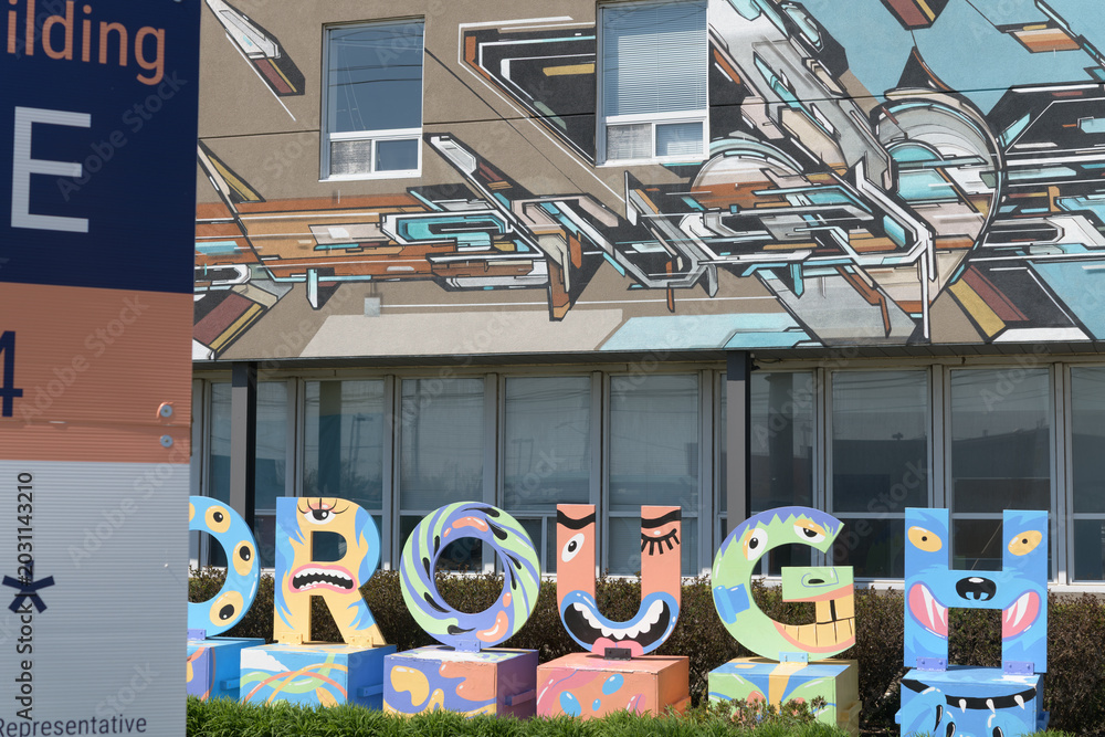 Fototapeta premium mural and jaunty sign outside 772 Warden Av, Scarborough, Toronto (Clairlea Food Bank)