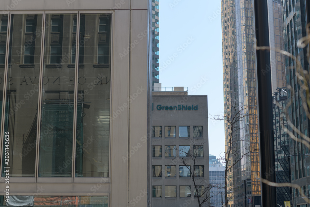 Naklejka premium Green Shield sign at Commerce Court South - looking south on Bay St from King St W, Toronto