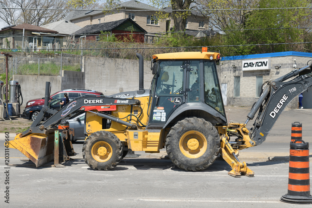Naklejka premium road work in Toronto, featuring a heavy machinery by Deere