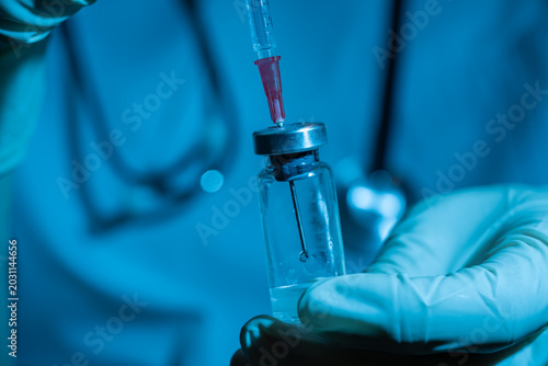 Photography intravenouse procedure: preparing a medical syringe and vaccine for a patient