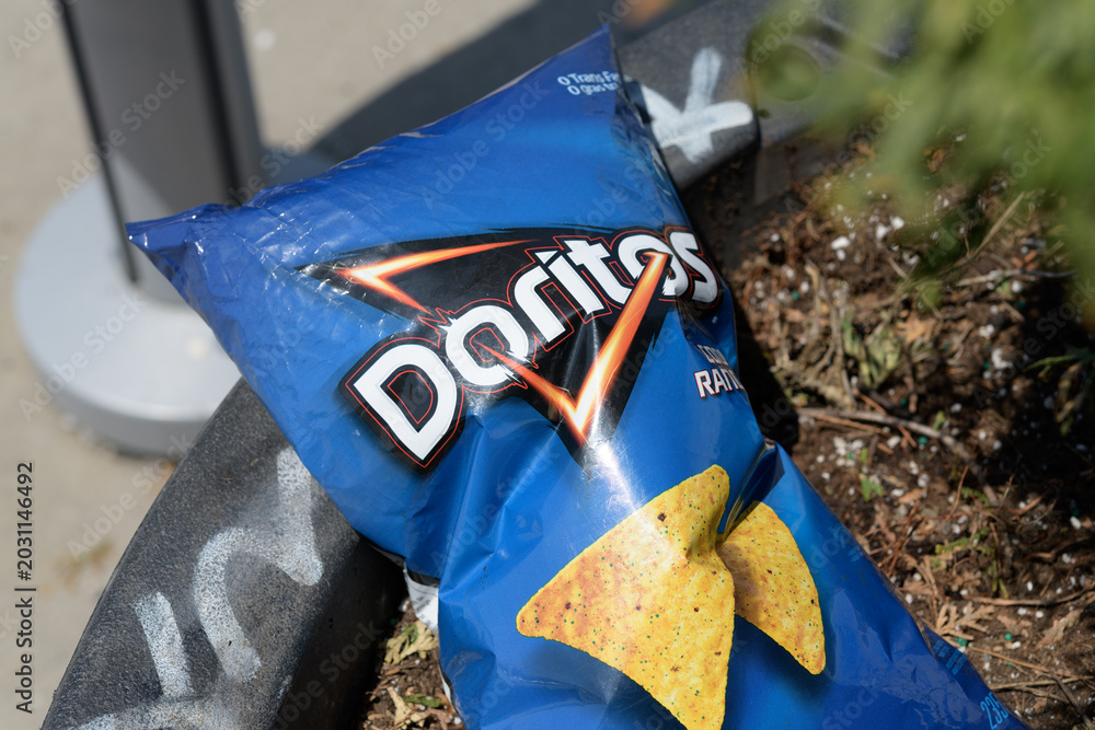 Naklejka premium discarded Biaxially Oriented Polypropylene (or bag) of Frito-Lay Doritos flavored tortilla chips, Toronto