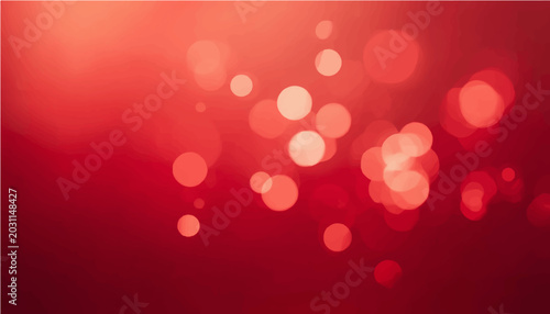 A festive abstract background of softly blurred red bokeh lights creates a warm and inviting atmosphere, perfect for celebrations or holiday themes.