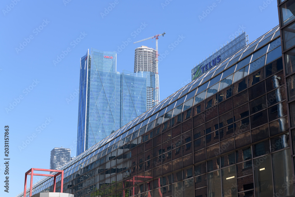 Naklejka premium looking southeast on Station St outside SkyWalk from Simcoe St to CIBC Square and SkyTower under construction, Toronto