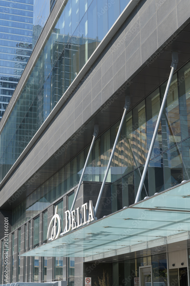 Naklejka premium sign over suspended canopy entrance to Delta hotel, 75 Lower Simcoe St, Toronto