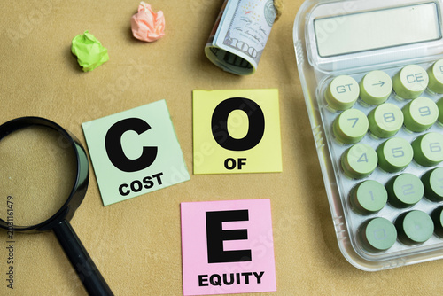 Tableau sur toile Concept of COE - Cost Of Equity write on sticky notes isolated on Wooden Table