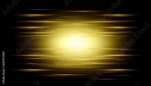 A bright yellow light shines with streaks of gold against a dark background creating a sense of motion and energy